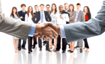 business person shaking hands after success